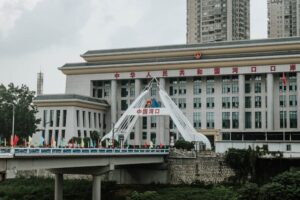 Urban scene featuring a bridge and government building in China.