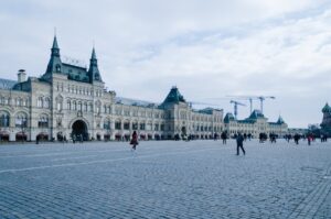 Historic GUM department store facade at Red Square under a cloudy sky, Moscow, Russia.